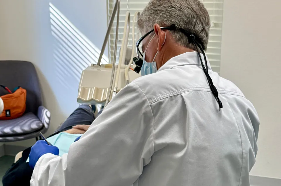 A patient smiling at State Street Dental
